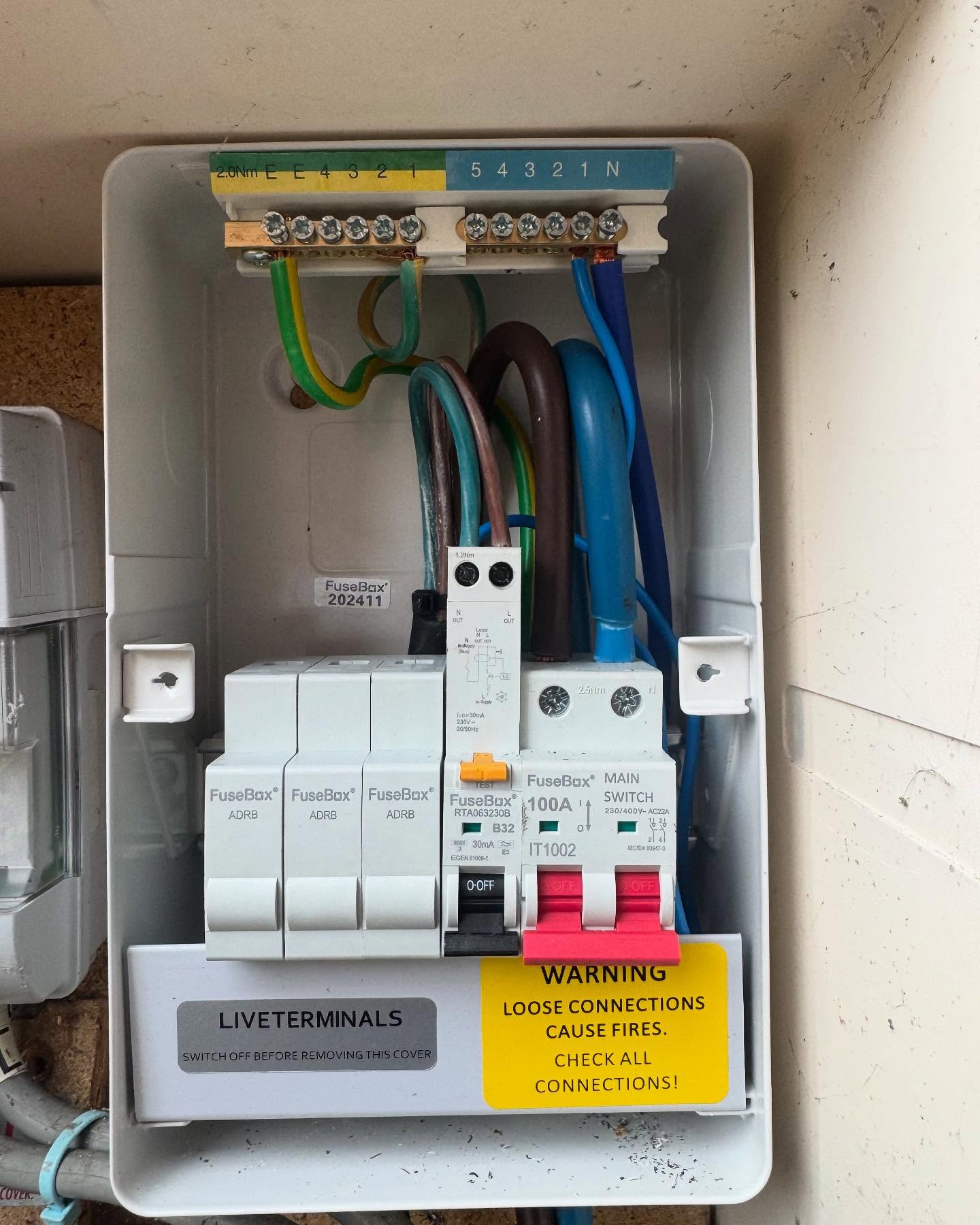 Electrical fuse box in cubby hole