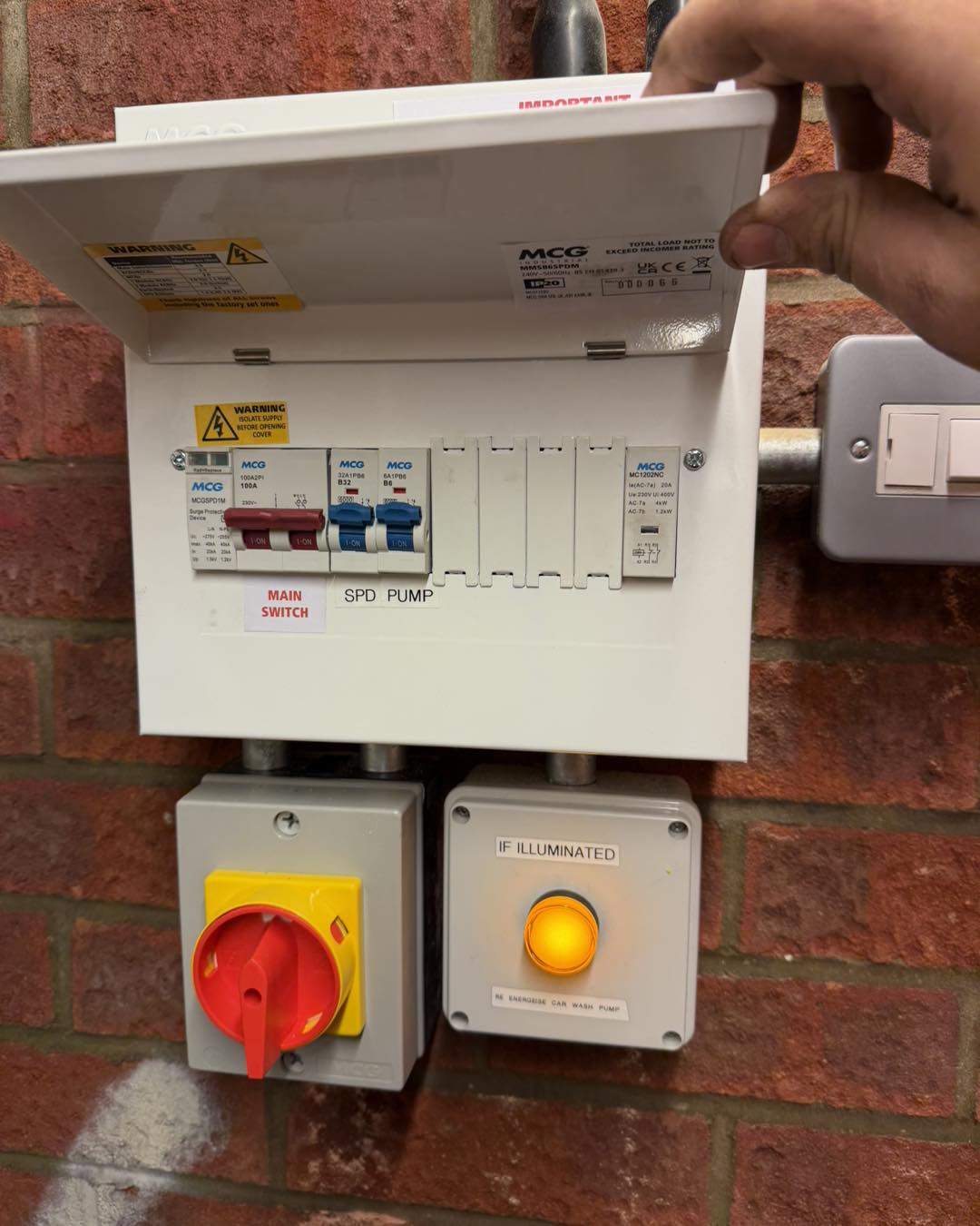 Man hold open an electrical box